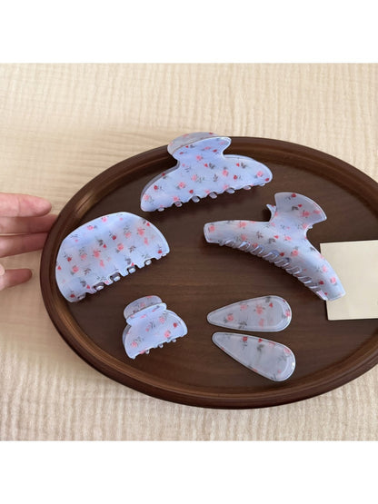 Beau gentle blue hair clip displayed on a white background