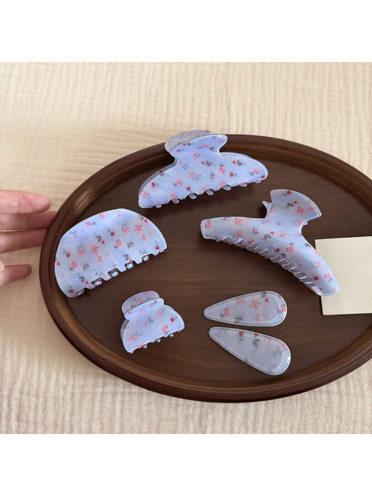 Beau gentle blue hair clip displayed on a white background