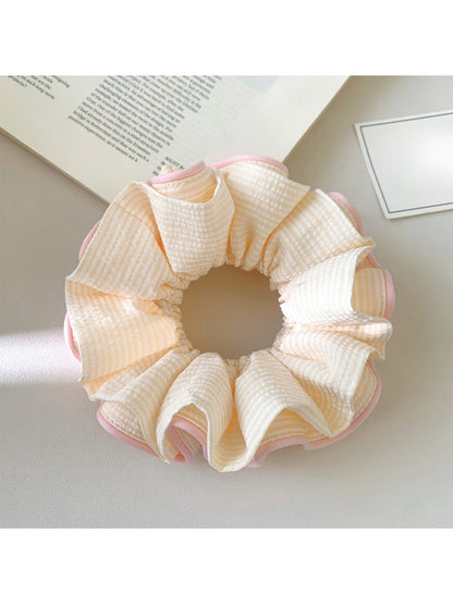 Pink ruffle beige scrunchie shown with matching accessories
