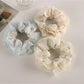 Gifty floral scrunchie displayed on a white background showing ruffled tulle details