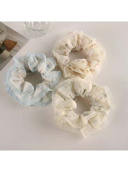 Gifty floral scrunchie displayed on a white background showing ruffled tulle details