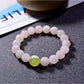 Close-up of Lovra minimalist pink crystal beaded bracelet on a white background