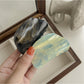 Beau claw clip open, displaying curved teeth and gradient color design