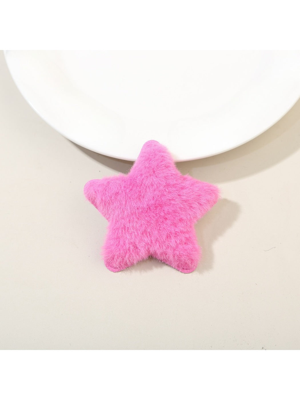 Beau star hair clip with visible metal clip backing on a plain white background