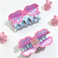 Beau claw clip shaped like eyeglasses holding hair in a bun