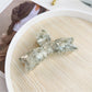 Beau hair claw clip photographed with soft natural lighting