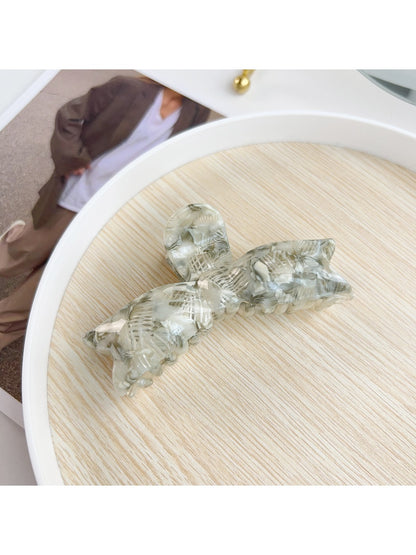 Beau hair claw clip photographed with soft natural lighting