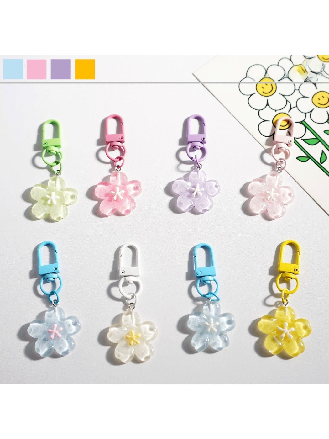 Sweet flower-shaped keychain with pastel colors on a white background