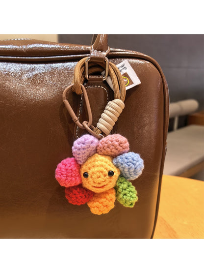 Keypus cute flower charm keychain attached to a backpack zipper pull