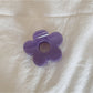 Beau minimalist mini flower claw clip held in hand showing scale