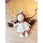 Keypus cartoon doll keychain shown with other accessories on a table