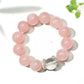 Close-up of Lovra pink beaded crystal bracelet with faceted beads on a white background
