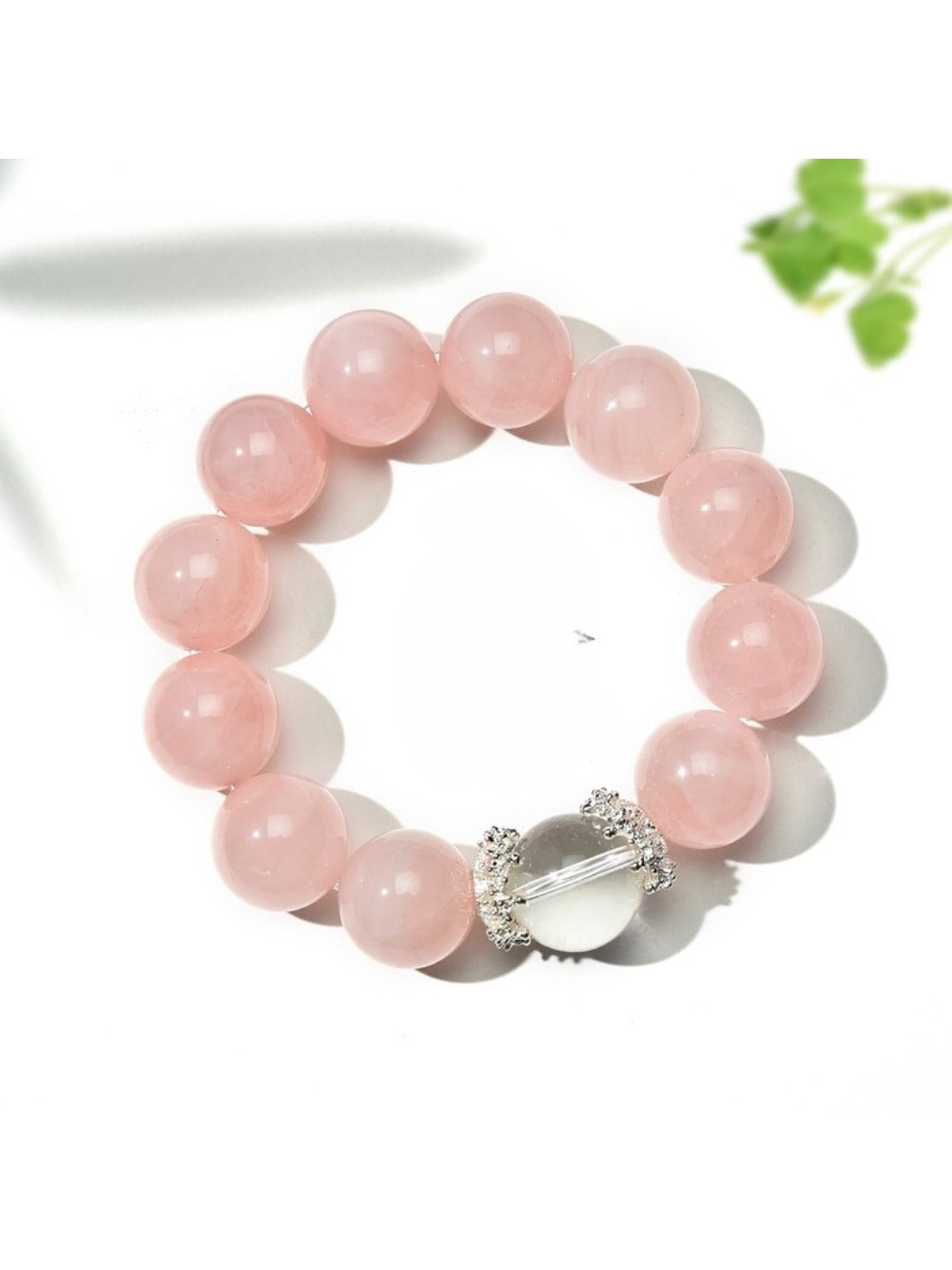 Close-up of Lovra pink beaded crystal bracelet with faceted beads on a white background