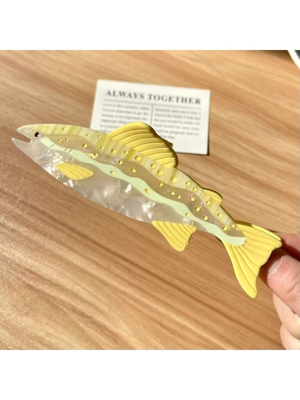 Beau elegant salmon shaped hair claw clip styled in hair