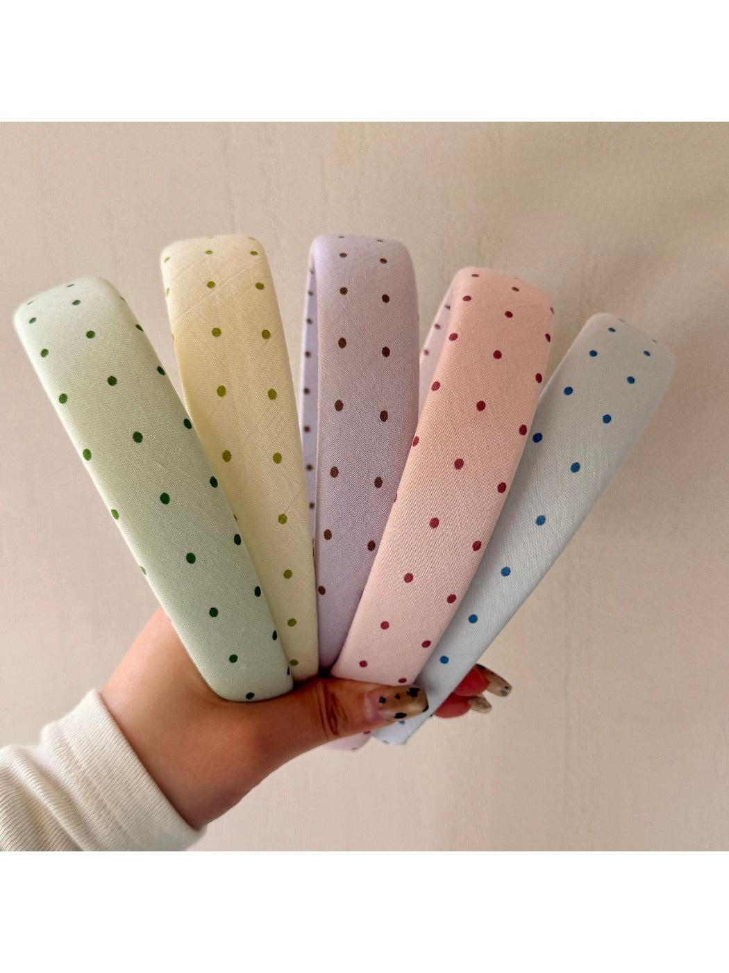 Gifty joyful polka dot colored headband displayed on white background
