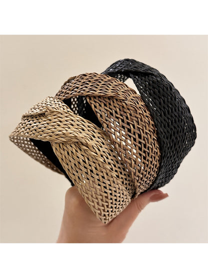 Close-up of Gifty chic woven cross headband in beige on white background