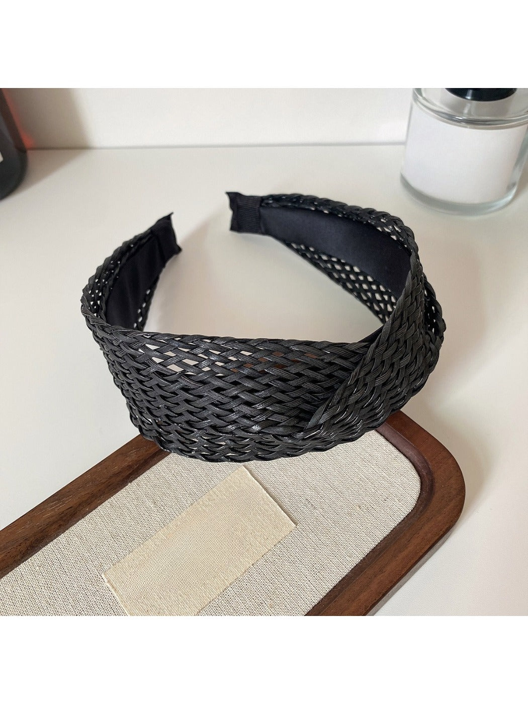 Top view of the headband highlighting the crisscross fabric detail
