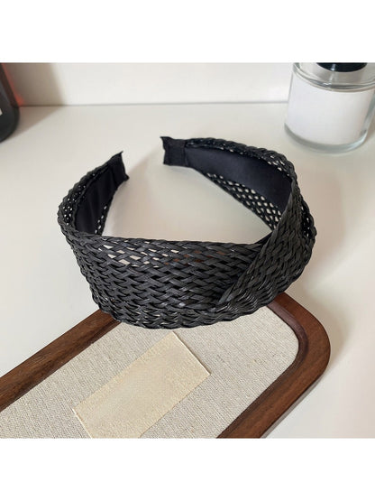 Top view of the headband highlighting the crisscross fabric detail
