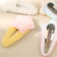 Top view of Beau fluffy star hair clip highlighting plush material and stitching
