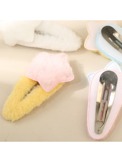 Top view of Beau fluffy star hair clip highlighting plush material and stitching