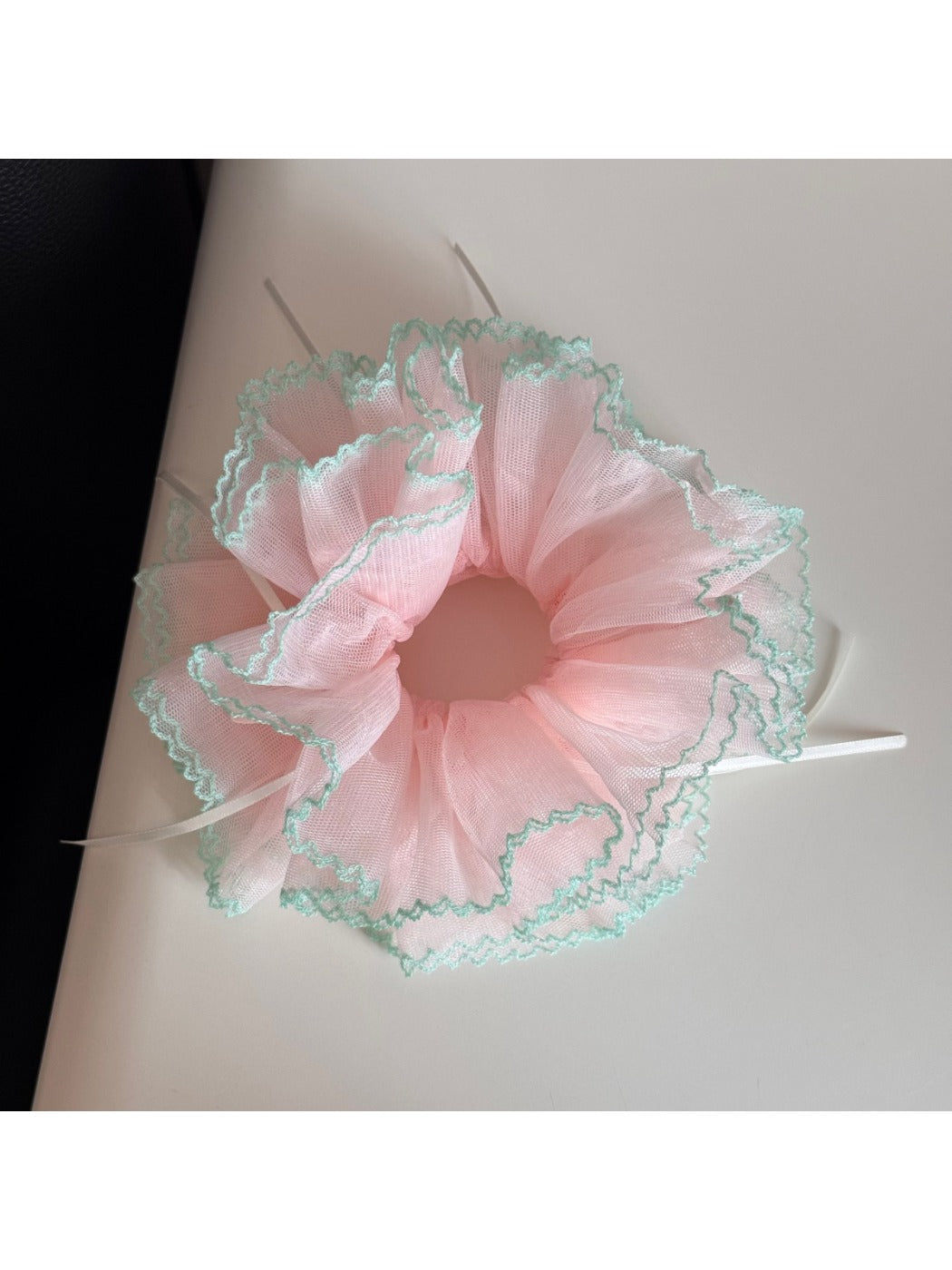 Top view of Gifty Ribbon Knot Tulle Scrunchie highlighting its layered tulle design