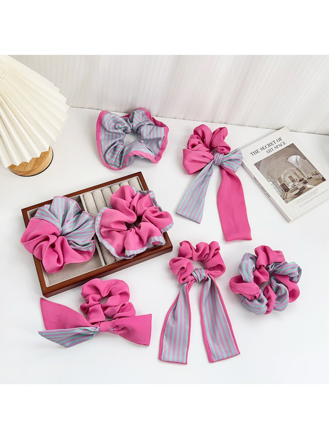 Magenta striped color block scrunchie on a white background