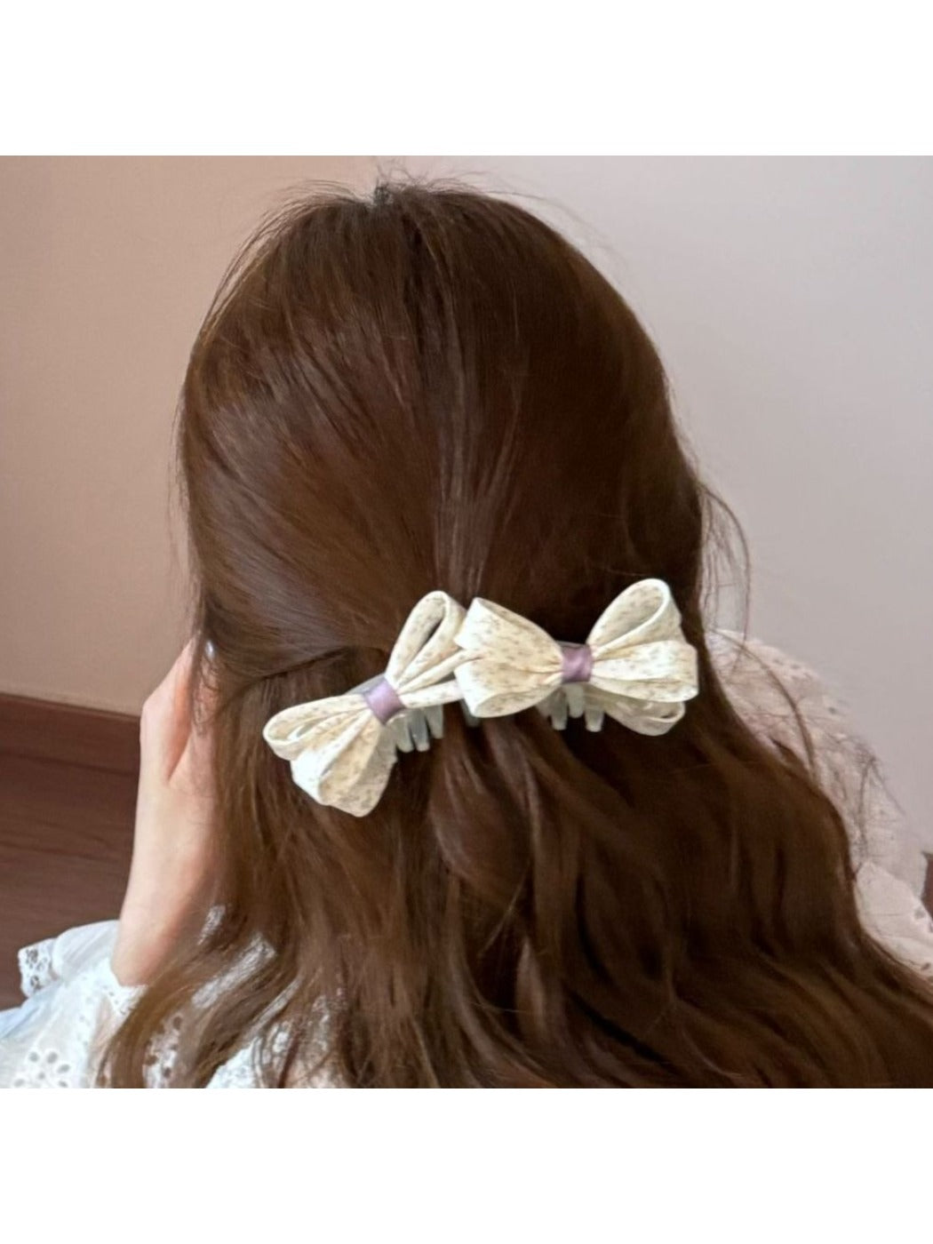Beau printed bow banana clip worn in long hair, styled in half-updo