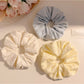Close-up of Gifty floral print scrunchie showing fabric texture and flower details