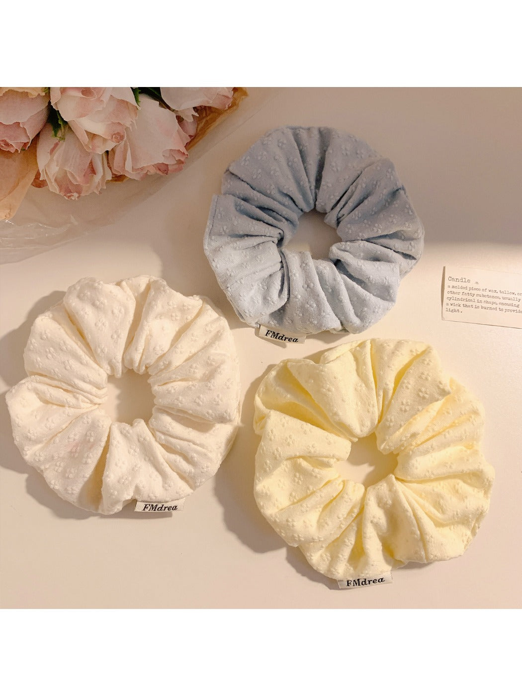 Close-up of Gifty floral print scrunchie showing fabric texture and flower details