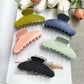 Beau polka dot acetate claw clip on white background showing front view