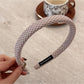 Top view of Gifty minimalist plaid headband showing its flexible band structure