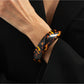 Lovra vintage asymmetrical bangle bracelet resting on a wooden surface