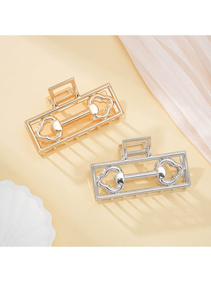 Beau Mysterious Retro Square Hair Clip in black with gold accents, front view