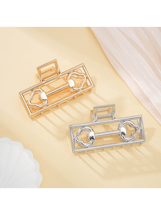 Beau Mysterious Retro Square Hair Clip in black with gold accents, front view