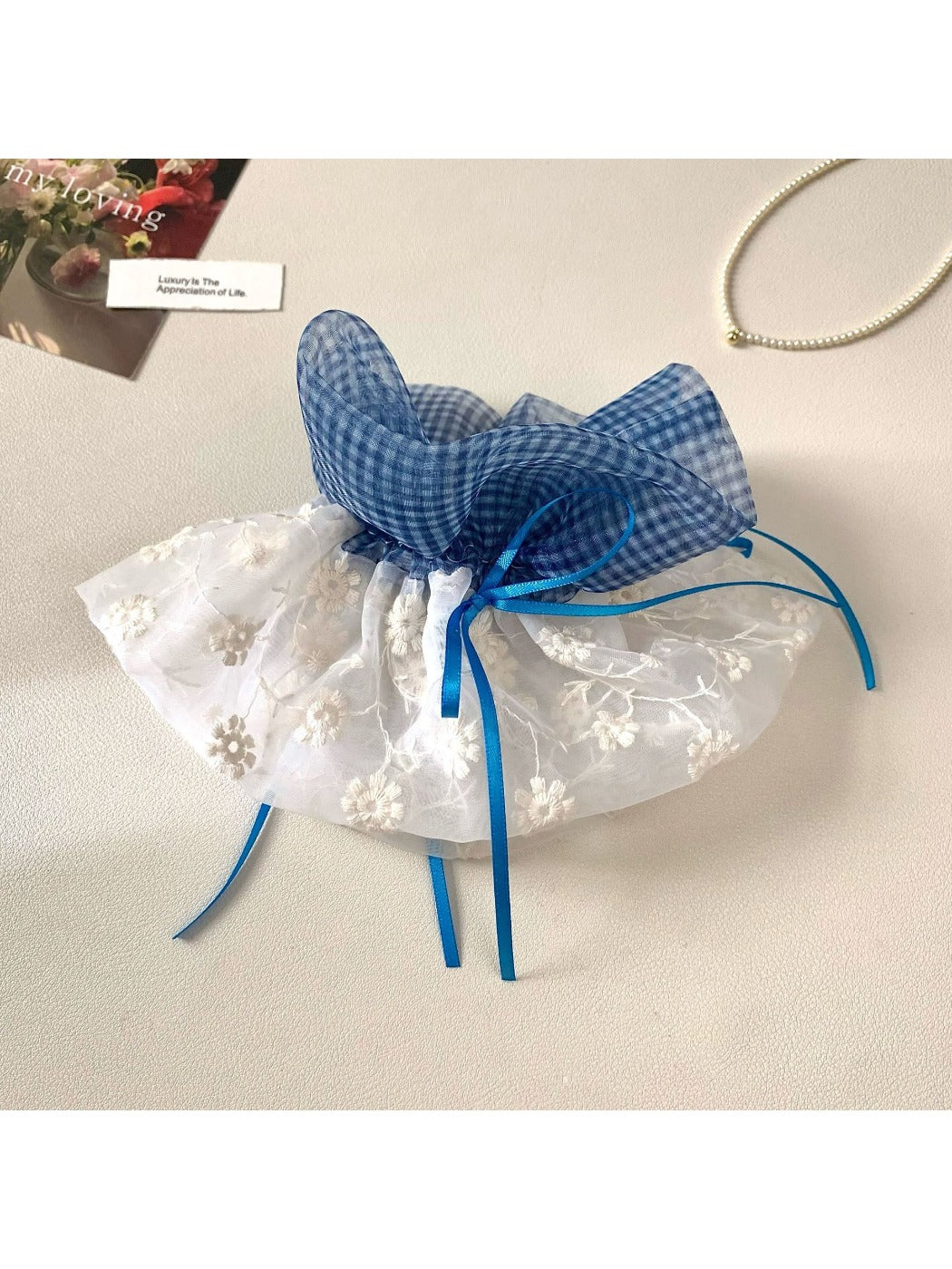 Close-up of Gifty plaid hair scrunchie showing fabric texture and layered design
