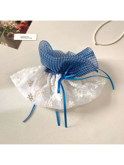 Close-up of Gifty plaid hair scrunchie showing fabric texture and layered design