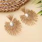 Earedge raffia drop earrings shown with gold-tone metal hooks