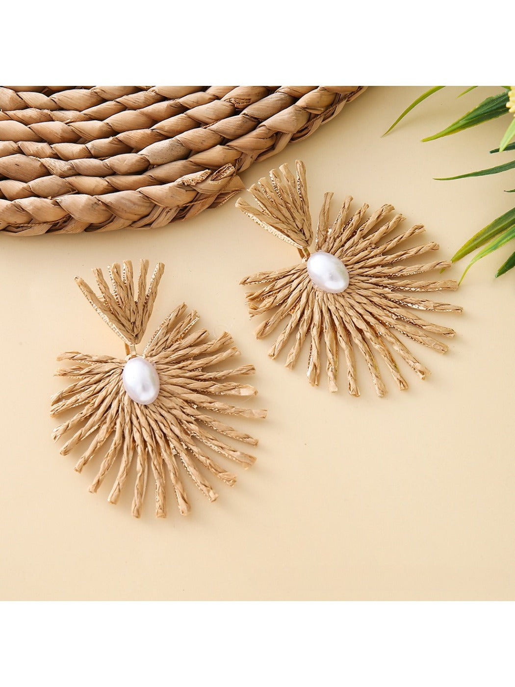 Earedge raffia drop earrings shown with gold-tone metal hooks