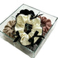 Close-up of Gifty scrunchie with red ribbon bow on a white background