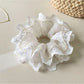 Gifty ruffled scrunchie displayed on a white background showing cutout details