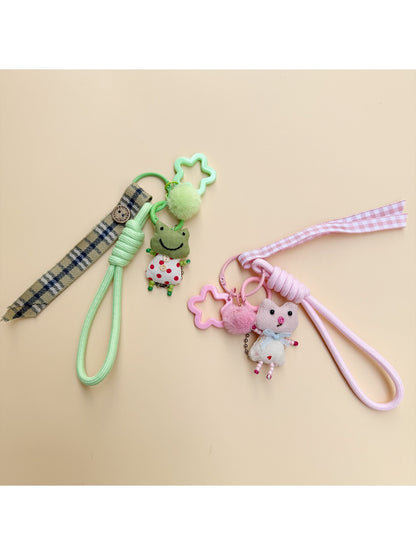 Fabric keychain shaped like a small animal with stitched details and a metal keyring