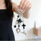 Ghost pendant keychain attached to a metal keyring with keys