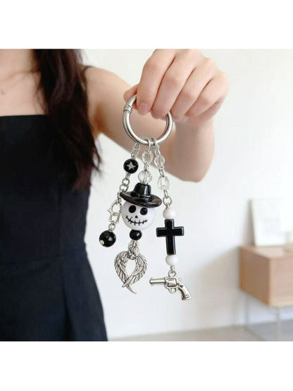 Ghost pendant keychain attached to a metal keyring with keys