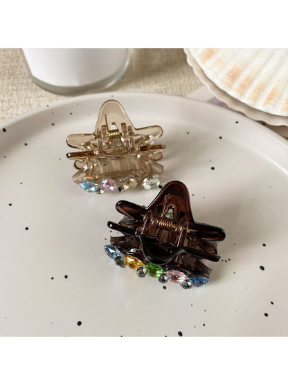 Side view of Beau five pointed star claw clip highlighting its slim profile