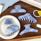 Blue plaid shark-shaped hair claw clip on white background