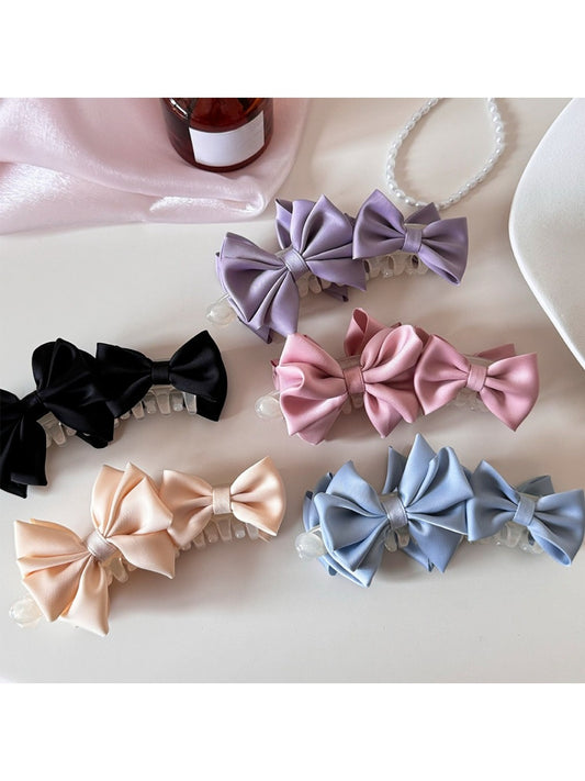 Beau satin bow banana clip in soft beige fabric on white background