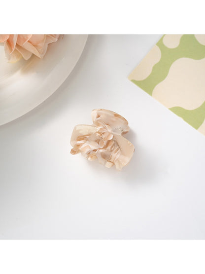 Beau hair clip photographed with soft lighting to enhance retro pattern