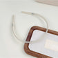 Top view of Gifty silky smooth headband showing curved shape and smooth surface