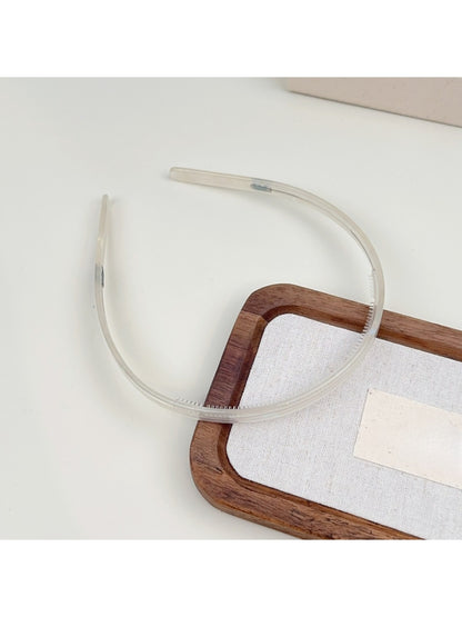 Top view of Gifty silky smooth headband showing curved shape and smooth surface