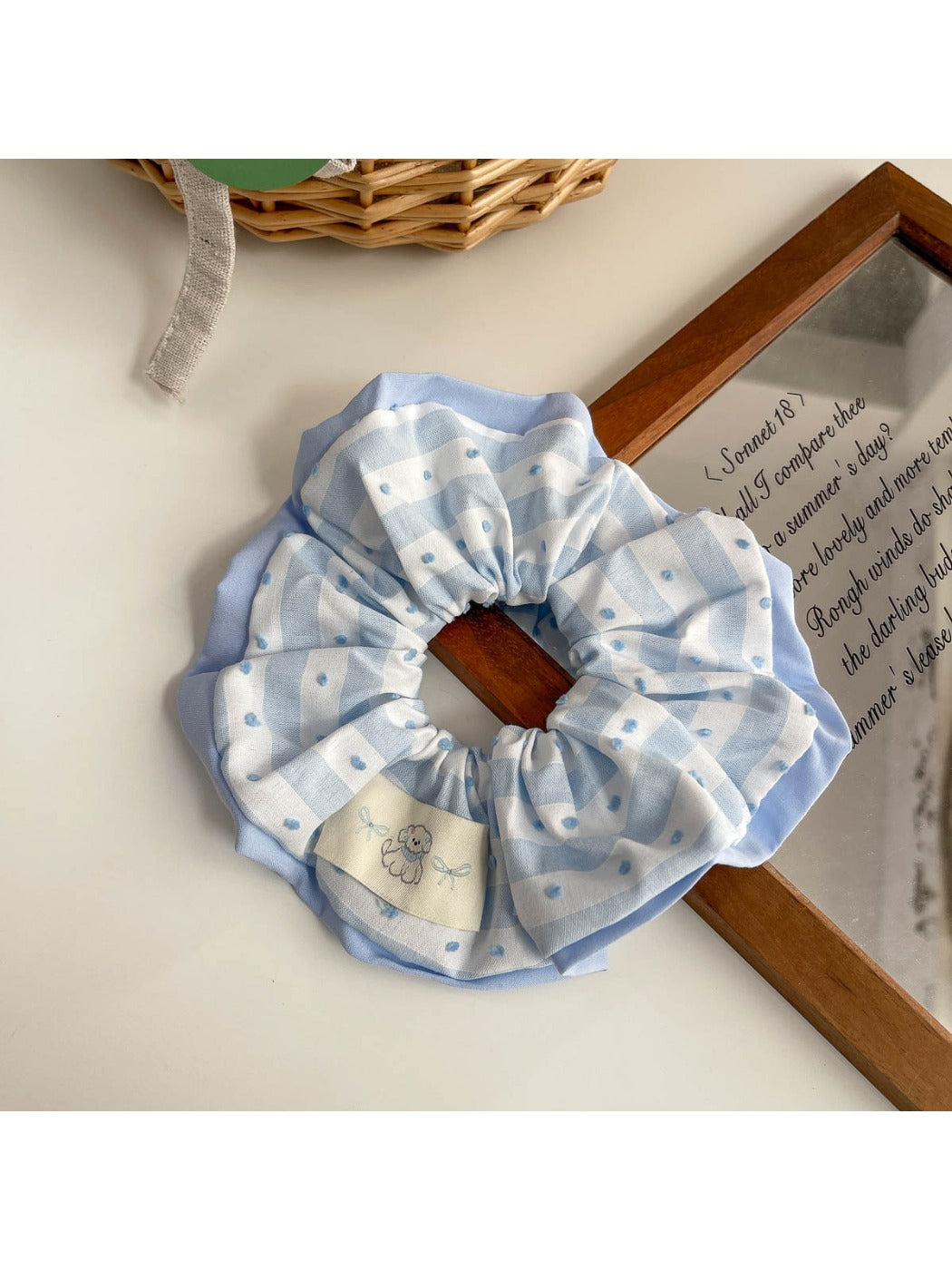 Hair clip close-up highlighting metal clasp and fabric cover